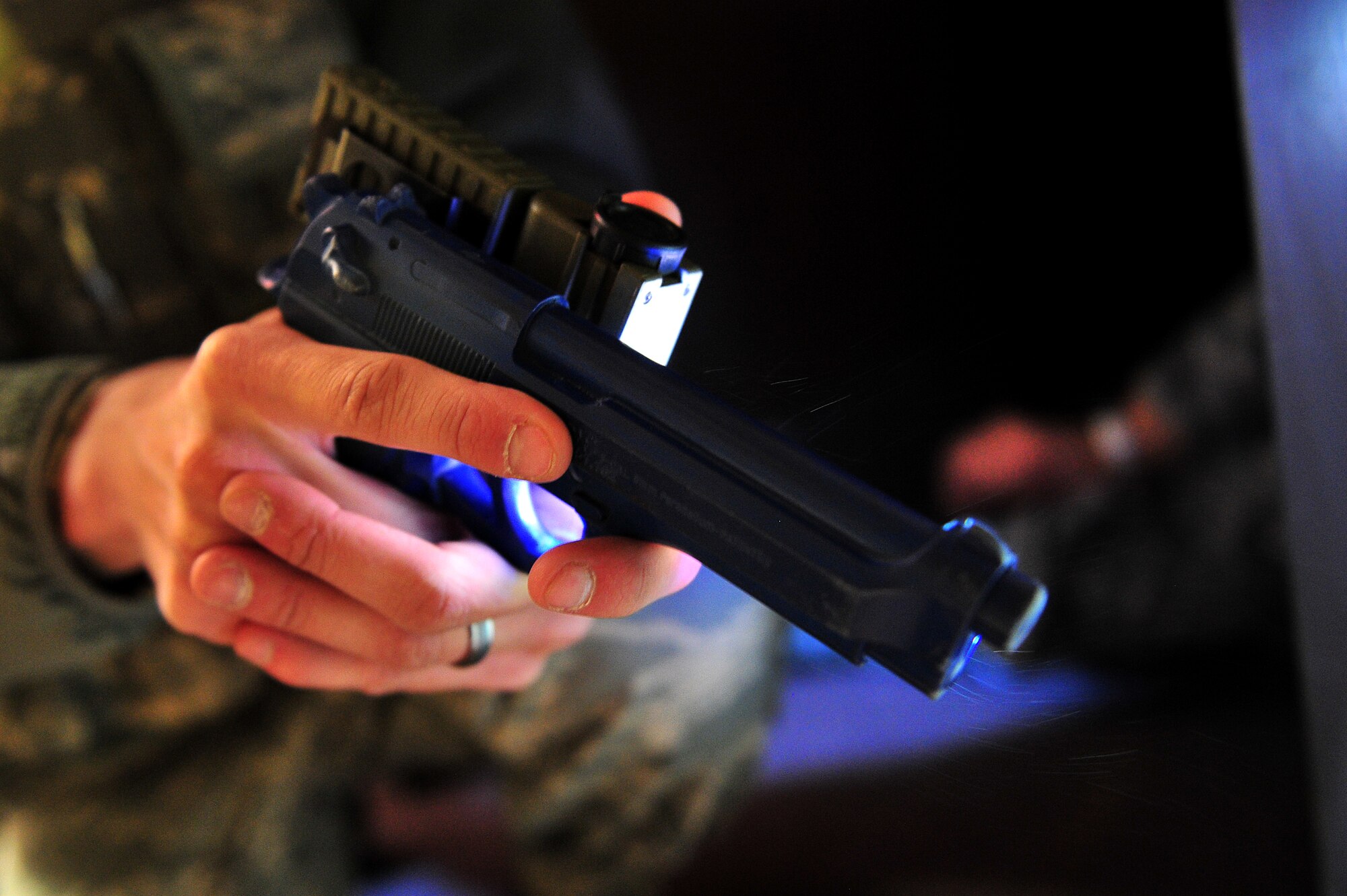 A U.S. Air Force Airman from the 27th Special Operations Security Forces Squadron, provides security with a rubber training weapon during an active shooter training scenario at Cannon Air Force Base, N.M., March 1, 2012. Training scenarios provide a safe and controlled environment to practice different tactics, techniques and procedures. (U.S. Air Force photo by Tech. Sgt. Josef Cole)