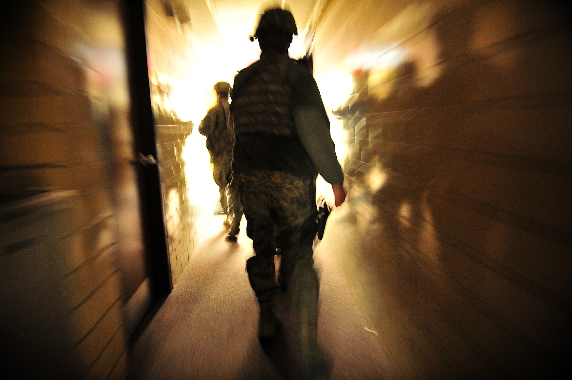 U.S. Air Force Airmen from the 27th Special Operations Security Forces Squadron, search a building for a simulated active shooter during a training scenario at Cannon Air Force Base, N.M., March 1, 2012. Training scenarios provide a safe and controlled environment to practice different tactics, techniques and procedures. (U.S. Air Force photo by Tech. Sgt. Josef Cole)