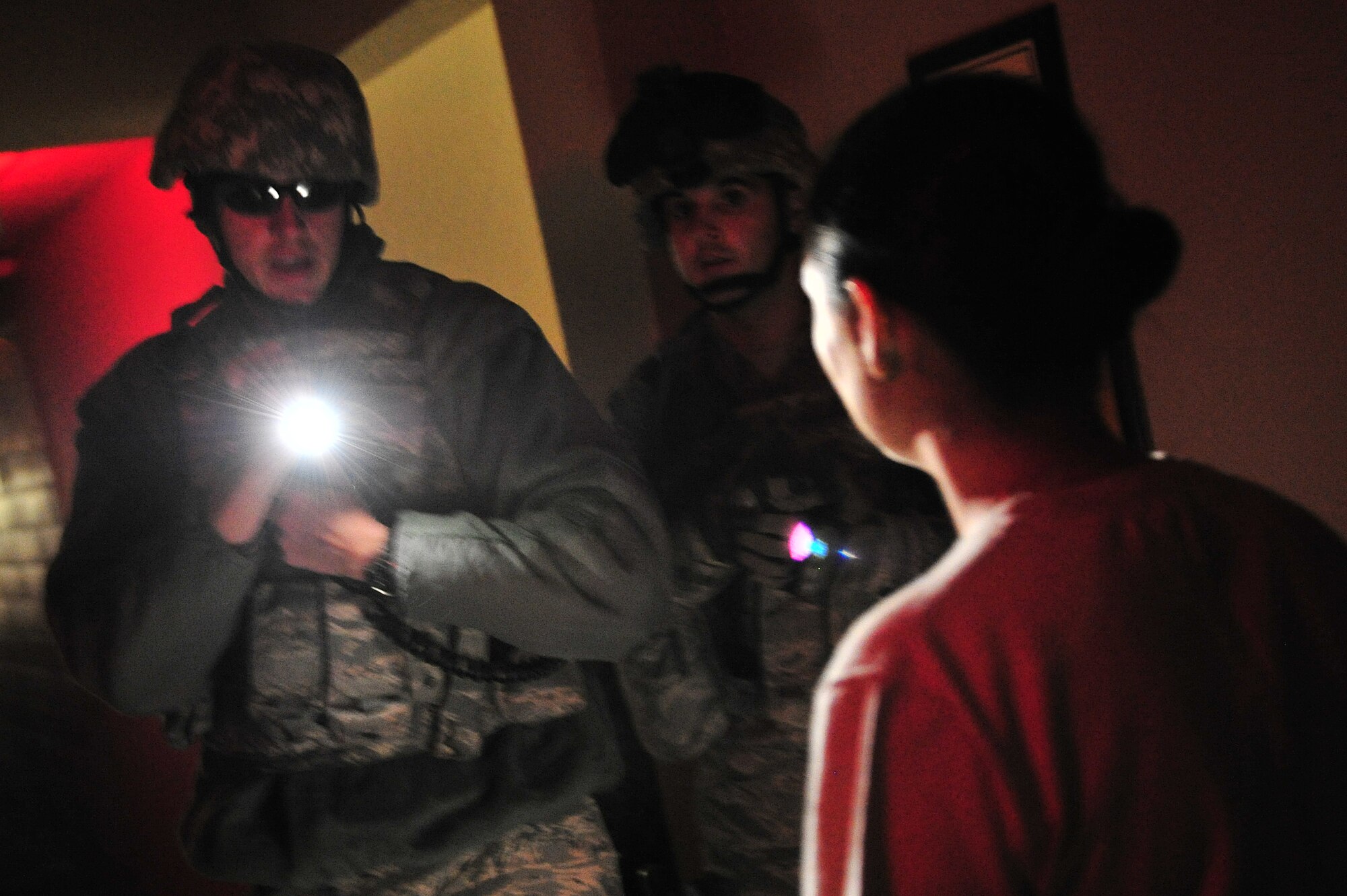 U.S. Air Force Staff Sgt. Charles East, 27th Special Operations Security Forces Squadron, confronts a simulated active shooter during a training scenario at Cannon Air Force Base, N.M., March 1, 2012. Training scenarios provide a safe and controlled environment to practice different tactics, techniques and procedures. (U.S. Air Force photo by Tech. Sgt. Josef Cole)