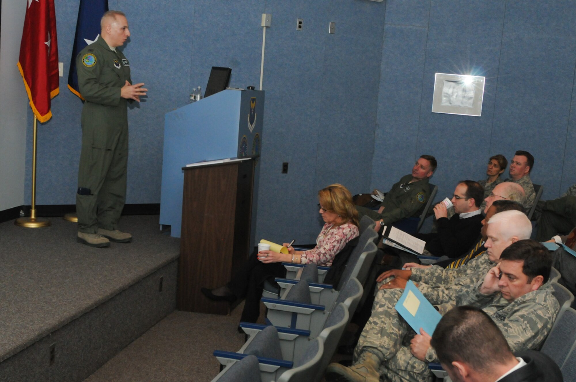 Col. Anthony Schiavi, 102nd Intelligence Wing commander, Otis Air National Guard Base, Mass., conducts a briefing for a group of local state and federal legislative leaders to provide them with a status update on the wing and its future objectives here, March 16. The group also took a tour of the 102nd Air Operations Group and a Joint Incident Site Communications Capability (JISCC) facility here. (National Guard photo by Tech. Sgt. Kerri Cole/Released)