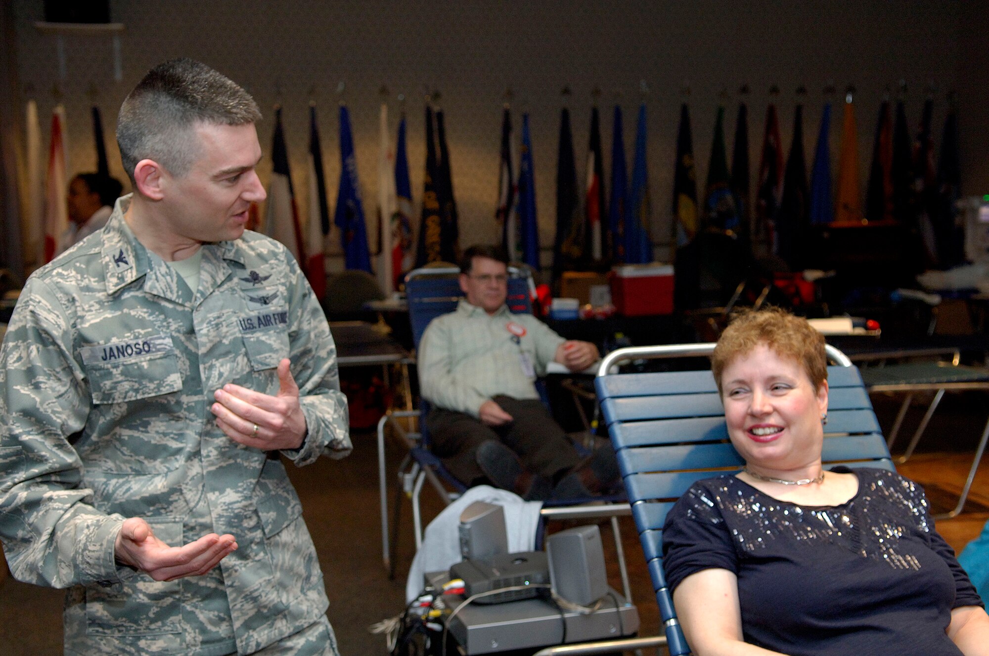 Col. Richard Janoso, Air Force Network Integration Center commander, congratulates Sheila Terrando, AFNIC mail clerk, on donating her 100th pint of blood March 13, 2012 at Scott Air Force Base, Ill. Terrando started donating blood in January of 1980 when she was a student of Patricia Steven’s Career College in St. Louis. (U.S. Air Force photo/Airman 1st Class Jake Eckhardt)