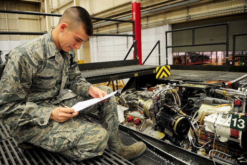 U.S. Air Force Airman Basic Casey Anderson, Air Force 362nd Training Squadron, 1st Detachment, completes the components identification portion of an exam, at the U.S. Army Aviation Logistics School, Feb. 7, 2012. Students from both services are tested by an open book written exam, a component identification test, and a hands-on portion of their helicopter training. (U.S. Air Force photo by Staff Sgt. Ashley Hawkins/Released)