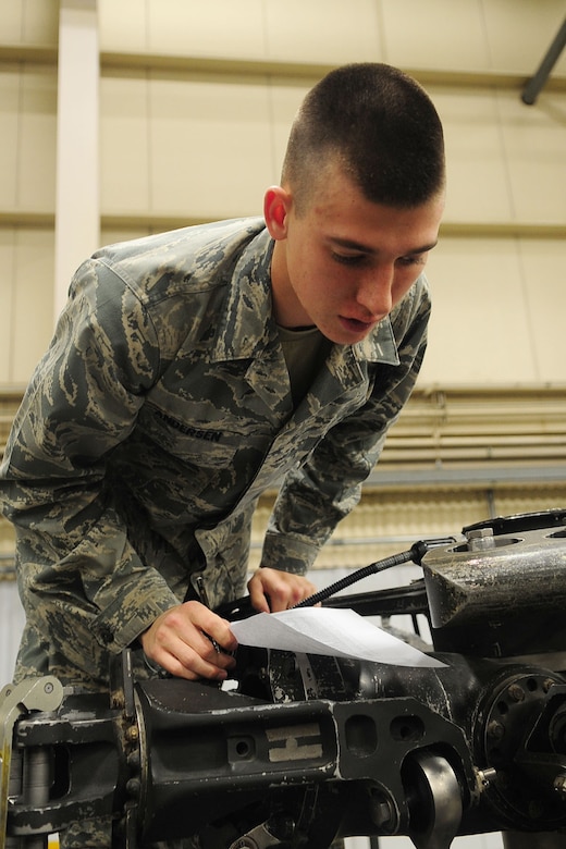 U.S. Air Force Airman Basic Casey Anderson, Air Force 362nd Training Squadron, 1st Detachment, searches for identifiable components of a Black Hawk model, at the U.S. Army Aviation Logistics School, Feb. 7, 2012. Each student learns a general knowledge of aircraft components, systems, and maintenance procedures.  (U.S. Air Force photo by Staff Sgt. Ashley Hawkins/Released)