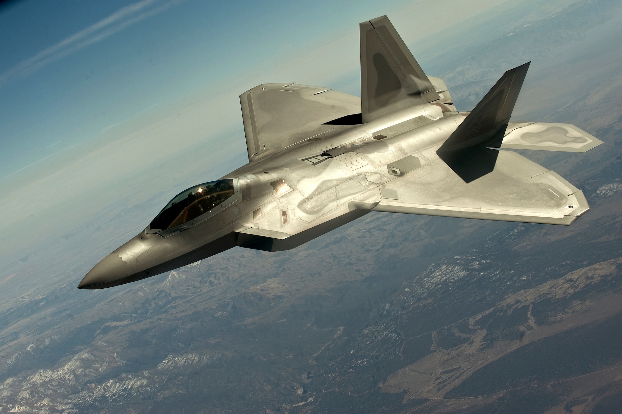 A U.S. Air Force F-22 Raptor, 1st Fighter Wing, Langley Air Force Base, Va., flies in a training mission during Red Flag 12-3 March 13, 2012, over the Nevada Test and Training Range. The exercise allows Airmen to experience intensive air combat operations in the safety of a training environment. (U.S. Air Force photo by Staff Sgt. Christopher Hubenthal)