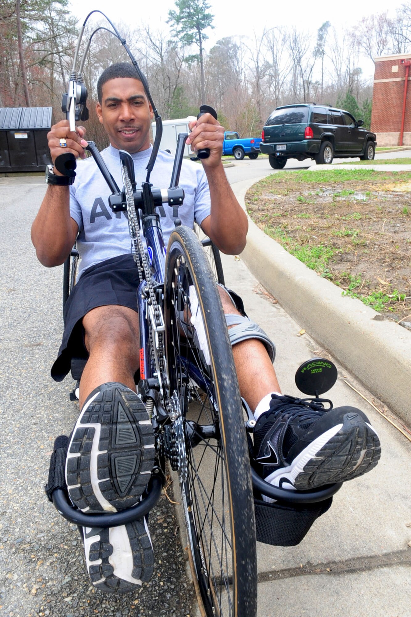 U.S. Army Sgt. Hilton Hunter, Warrior Transition Unit, rides a modified bicycle outside the McClellan Fitness Center, March 9, 2012. Hunter began treatment in the Warrior Transition Unit five months before participating in adaptive sports. (U.S. Air Force photo by Staff Sgt. Ashley Hawkins/Released)
