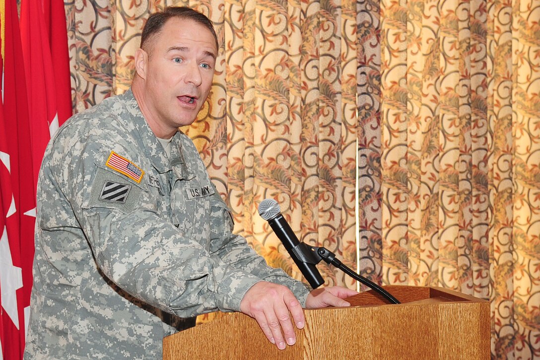 U.S. Army Col. Thomas Wetherington, 733rd Mission Support Group commander, renders closing remarks during the National Prayer Breakfast at Fort Eustis, Va., March 15, 2012. Airmen, Soldiers and civilian employees gathered in fellowship to celebrate a morning of prayer, which featured the pursuit of life, liberty and happiness as its theme. (U.S. Air Force photo by Staff Sgt. Ashley Hawkins/Released)
