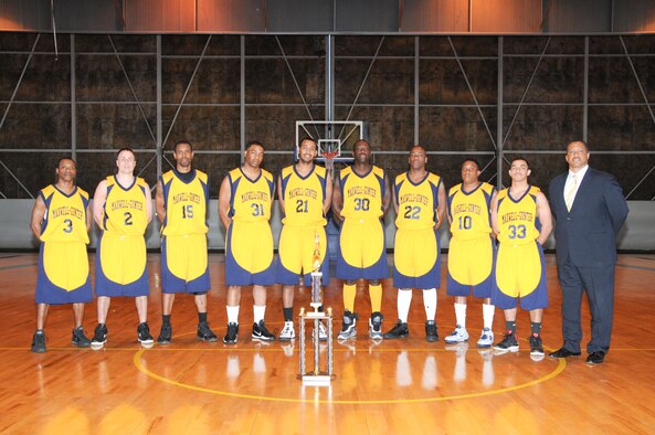 The Maxwell-Gunter Warriors varsity basketball team, shown alongside coach Marvie Epps, ended the regular season as Southeastern Military Athletic Conference champions, reaching the playoffs as the top seed in the seven-team league. Three players – Senior Airman Larry Haynes, Staff Sgt. Brian Cooper and Staff Sgt. Troy Hoover – were picked for the all-tournament team with coach Marvie Epps earning the conference's coach of the year. Haynes also was honored as most valuable player for the regular season and the conference. (Air Force photo/Bud Hancock)