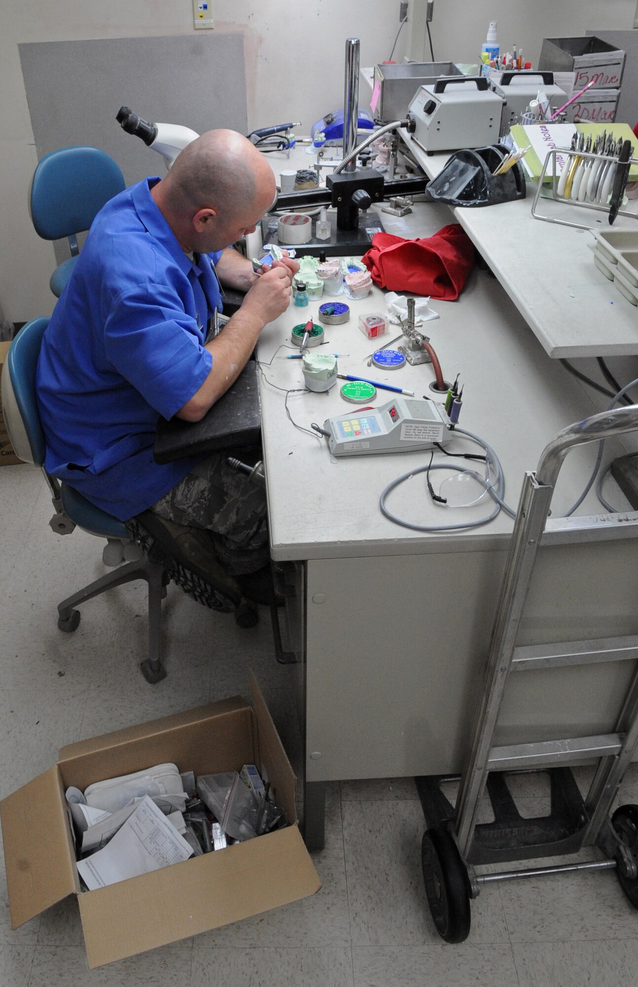 Tech. Sgt. William Fitzpatrick, 2nd Dental Squadron lab craftsman, works on an implant in the dental lab on Barksdale Air Force Base, La., March 13. In order to prepare for renovations March 15, lab technicians and other dental Airmen moved equipment out of the lab. (U.S. Air Force photo/Airman 1st Class Micaiah Anthony)(RELEASED)
