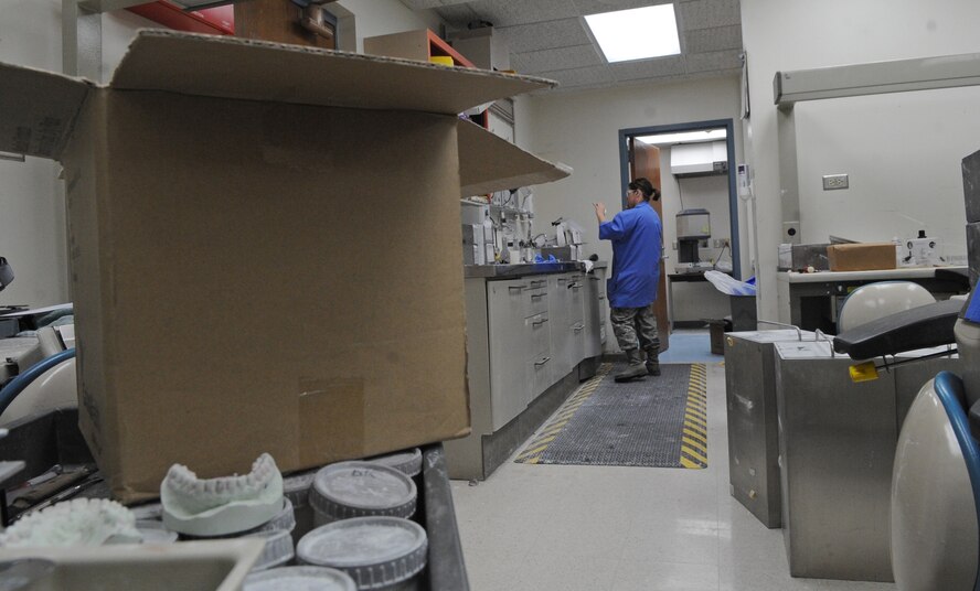 Senior Airman Heather Nowak, 2nd Dental Squadron lab technician, works on a cast in the dental lab on Barksdale Air Force Base, La., March 13. In order to prepare for renovations March 15, lab technicians and other dental Airmen moved equipment out of the lab. (U.S. Air Force photo/Airman 1st Class Micaiah Anthony)(RELEASED)
