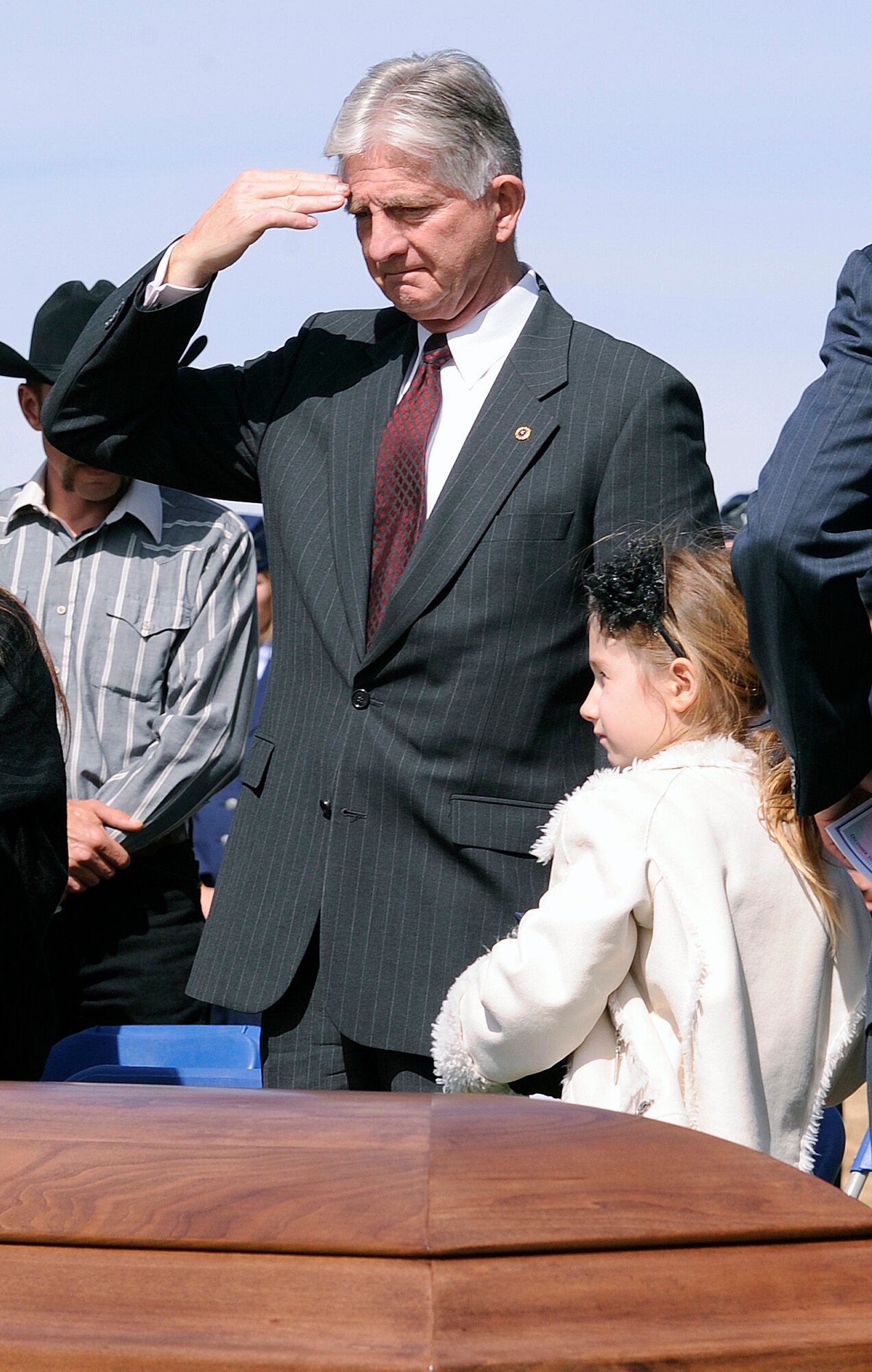 Dennis Hall salutes the casket of his son, Capt. Ryan Hall, during a funeral service at the Air Force Academy March 12, 2012. The younger Hall was killed Feb. 18 in an aircraft accident near Camp Lemonnier, Djibouti. The elder Hall is a 1970 graduate of the Academy. (U.S. Air Force photo/Sarah Chambers)