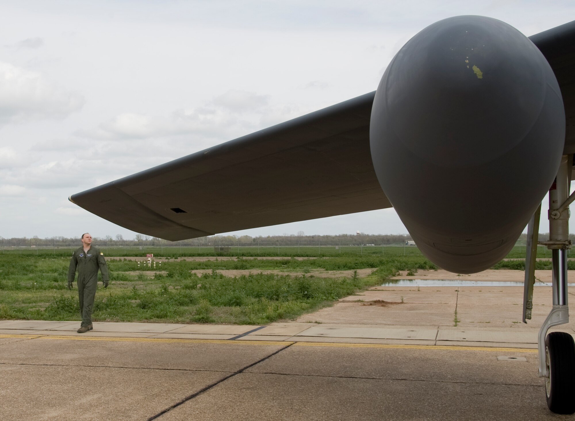 Maj. Brian Sealock, 20th Bomb Squadron, inspects the wing of a B-52H Stratofortress on Barksdale Air Force Base, La., March 13. Members of the aircrew inspect the aircraft before going inside. Each member has his or her own specific items of interest they look at as they conduct their inspections before takeoff. (U.S. Air Force photo/Airman 1st Class Benjamin Gonsier)(RELEASED)
