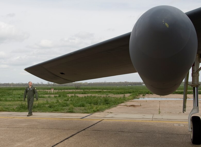 Maj. Brian Sealock, 20th Bomb Squadron, inspects the wing of a B-52H Stratofortress on Barksdale Air Force Base, La., March 13. Members of the aircrew inspect the aircraft before going inside. Each member has his or her own specific items of interest they look at as they conduct their inspections before takeoff. (U.S. Air Force photo/Airman 1st Class Benjamin Gonsier)(RELEASED)