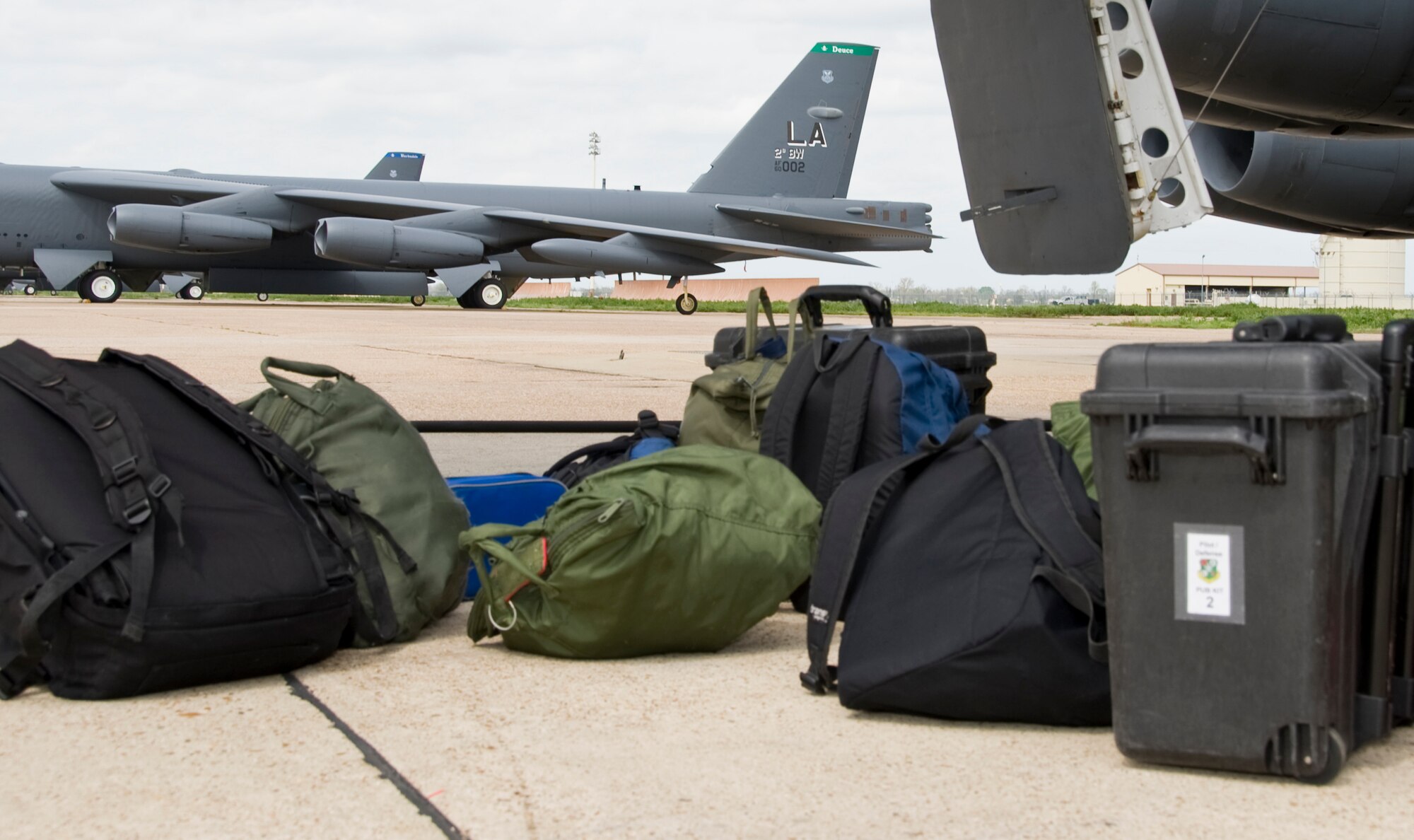 Flight equipment rests on the flightline on Barksdale Air Force Base, La., March 13. The aircrew brings an assortment of equipment with them including their helmets, technical orders and food while on their flight. (U.S. Air Force photo/Airman 1st Class Benjamin Gonsier)(RELEASED)
