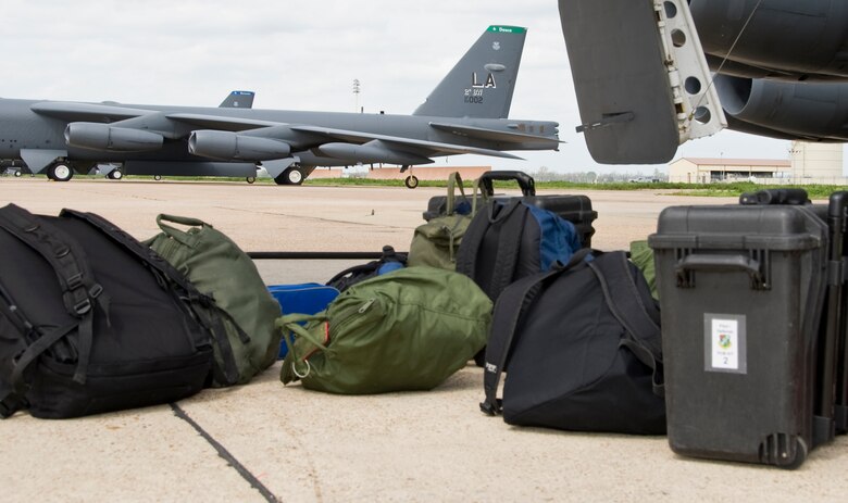 Flight equipment rests on the flightline on Barksdale Air Force Base, La., March 13. The aircrew brings an assortment of equipment with them including their helmets, technical orders and food while on their flight. (U.S. Air Force photo/Airman 1st Class Benjamin Gonsier)(RELEASED)