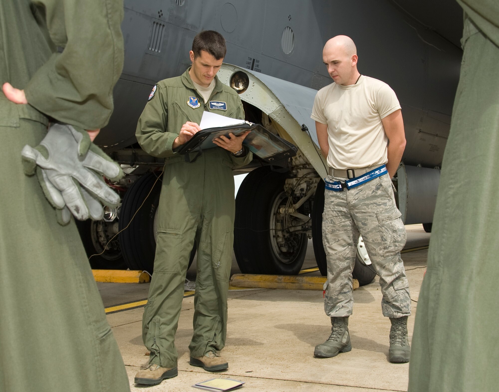 Capt. Joseph Blanc, 20th Bomb Squadron, looks over maintenance forms on Barksdale Air Force Base, La., March 13. The crew chiefs fill out forms that highlight discrepancies and maintenance on the aircraft. The aircrew goes over the forms so they know the condition of the aircraft. (U.S. Air Force photo/Airman 1st Class Benjamin Gonsier)(RELEASED)
