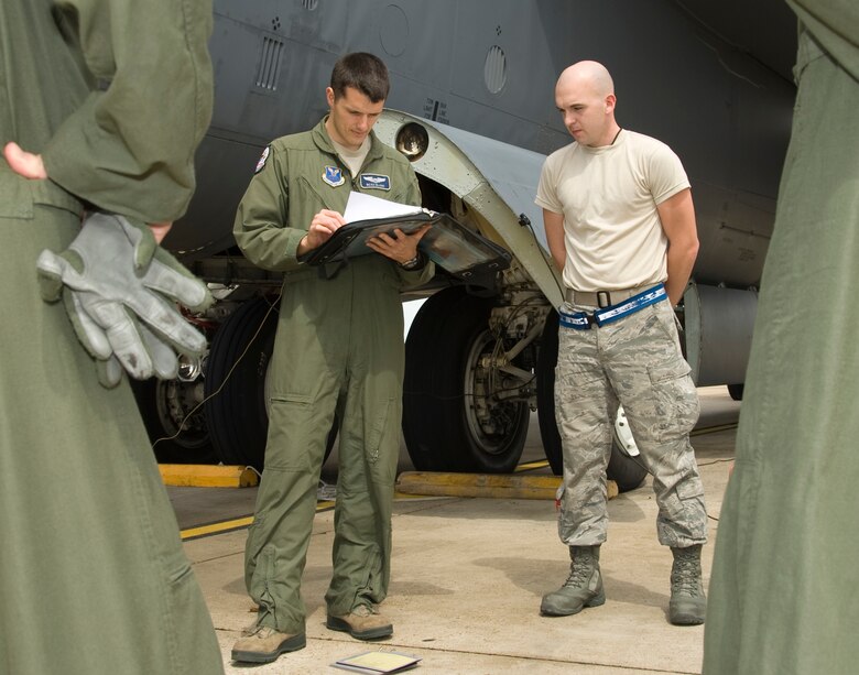 Capt. Joseph Blanc, 20th Bomb Squadron, looks over maintenance forms on Barksdale Air Force Base, La., March 13. The crew chiefs fill out forms that highlight discrepancies and maintenance on the aircraft. The aircrew goes over the forms so they know the condition of the aircraft. (U.S. Air Force photo/Airman 1st Class Benjamin Gonsier)(RELEASED)
