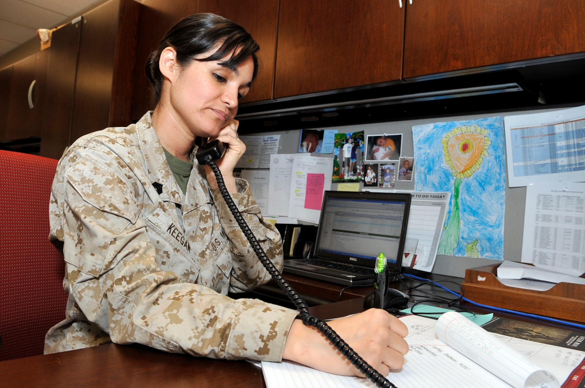 Marine Sgt. Cicilia Keegan performs her daily duties as adjutant and clerk to Col. Christopher Papaj, Marine Aircraft Group 49 commander, March 13 here. Cicilia is a native of Mentone, Calif. (U.S. Air Force photo by Wayne Russell/Released)