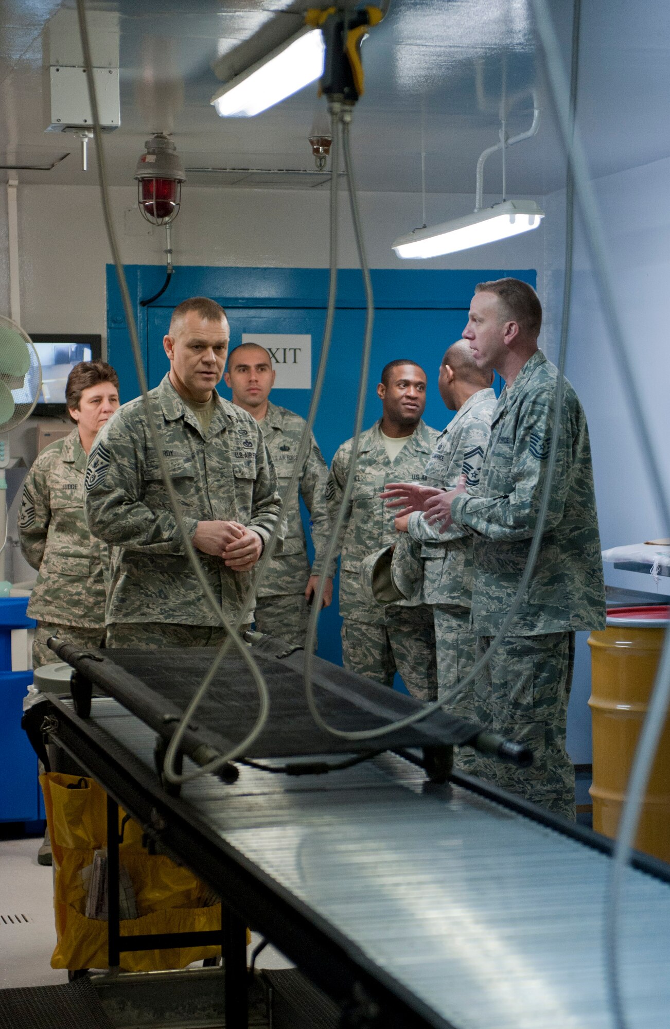 Tech. Sgt. Kristopher Auger, 39th Medical Operations Squadron, front right, explains a decontamination process with Chief Master Sgt. of the Air Force James Roy, front left, March 16, 2012, at Incirlik Air Base, Turkey. Roy and Auger discuss the importance of timeliness and safety when processing contaminated patients. (U.S. Air Force photo by Senior Airman Anthony Sanchelli/Released)
