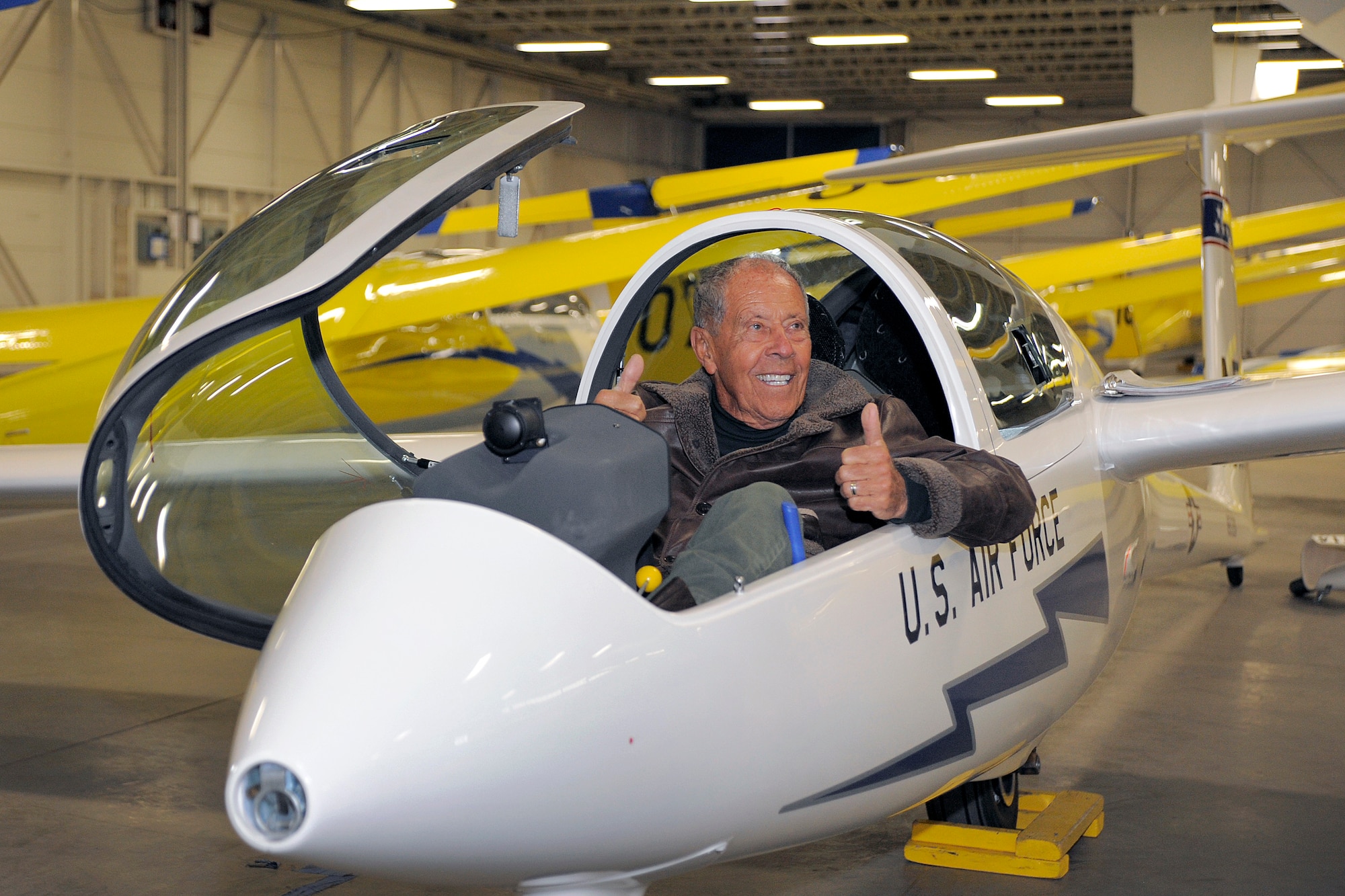 Nick Bollittieri flashes two thumbs up from the cockpit of a glider at the Air Force Academy Airfield Feb. 22, 2012. Bollittieri, who spoke at the Academy's 2012 National Character and Leadership Symposium, is a tennis coach who has developed such players as Andre Agassi and Monica Seles. (U.S. Air Force photo/Raymond McCoy)