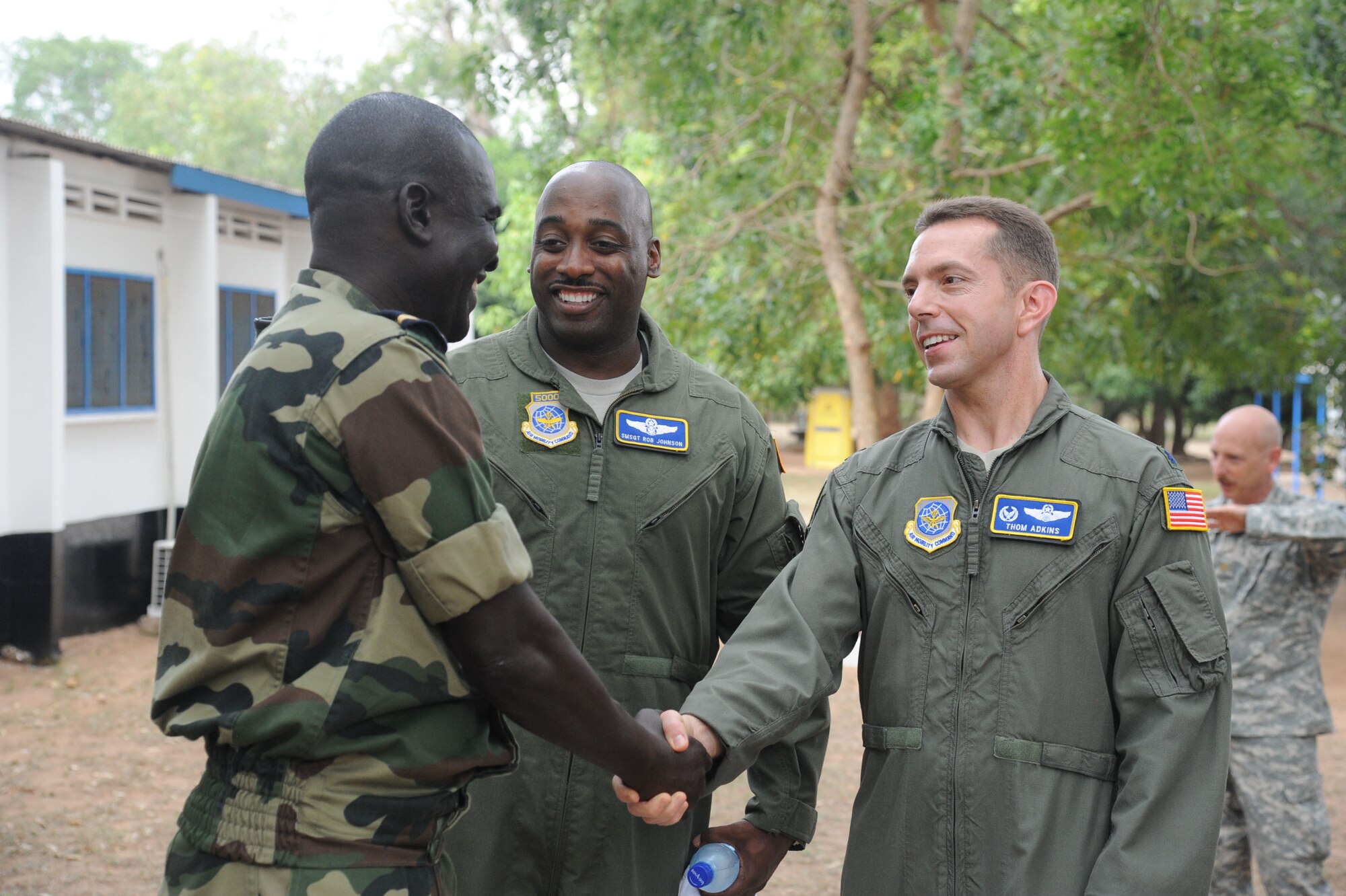 Lt. Col. Thomas Adkins, 818th Mobility Support Advisory Squadron commander, and Senior Master Sgt. Robert Johnson, 818th MSAS superintendent, meet with a service member from Senegal at the Inaugural African Partnership Flight event in Accra, Ghana, March 14. The partnership event brings together U.S. service members with counterparts from militaries throughout Africa. The event is a two week military-to-military multilateral and regional engagement event involving the partnership of U.S., Benin, Ghanaian, Nigerian, Togon, and Senegalian air forces. (U.S. Air Force photo by Capt. Brooke Brzozowske/Released)

