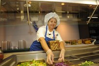 Diana Bailey, 902nd Force Support Squadron Dining Facility salad technician, stocks the salad bar in preparation for lunch time at the Joint Base San Antonio-Randolph Dining Facility here March 9, 2012. (U.S. Air Force photo by Rich McFadden) (released)