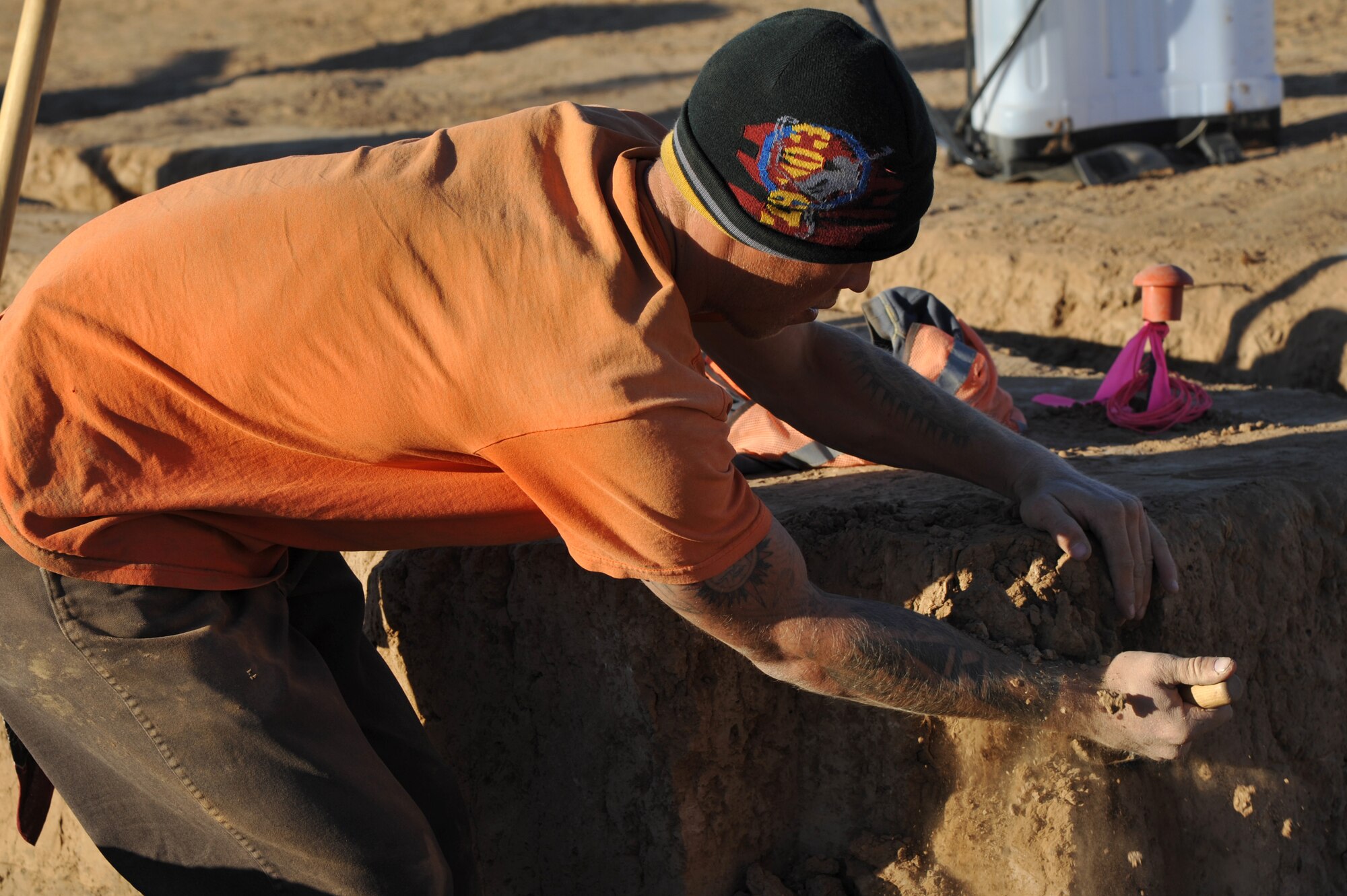 George Tinseth, archaeologist field technician, digs for artifacts at an archaeological site on Luke Air Force Base.  (U.S. Air Force photo by Senior Airman Sandra Welch)