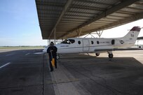 Robert Riojas, 12th Flying Traing Wing Maintenance Division, pulls the chalks prior to the launch of a T-1 Jayhawk aircraft from the 99th Flying Training Squadron on Joint Base San Antonio-Randolph March 6, 2012. The 99th FTS is an important part of the Pilot Instructor Training program at JBSA-Randolph. (U.S. Air Force photo by Rich McFadden) (released)