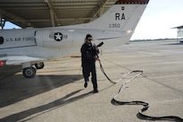 Robert Riojas, 12th Flying Traing Wing Maintenance Division, disconnects external power prior to the launch of a T-1 Jayhawk aircraft from the 99th Flying Training Squadron on Joint Base San Antonio-Randolph March 6, 2012. The 99th FTS is an important part of the Pilot Instructor Training program at JBSA-Randolph. (U.S. Air Force photo by Rich McFadden) (released)