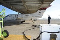 Robert Riojas, 12th Flying Traing Wing Maintenance Division, checks controll surfaces prior to the launch of a T-1 Jayhawk aircraft from the 99th Flying Training Squadron on Joint Base San Antonio-Randolph March 6, 2012. The 99th FTS is an important part of the Pilot Instructor Training program at JBSA-Randolph. (U.S. Air Force photo by Rich McFadden) (released)