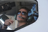 1st Lt. Casey Eikhold, 99th Flying Training Squadron, makes final checks prior to the launch of a T-1 Jayhawk aircraft on Joint Base San Antonio-Randolph March 6, 2012. The 99th FTS is an important part of the Pilot Instructor Training program at JBSA-Randolph. (U.S. Air Force photo by Rich McFadden) (released)