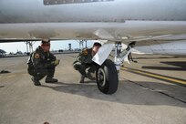 Lt. Col. James Drake (left) and Maj. Kevin Kotula, 99th Flying Training Squadron, make a final inspection prior to the launch of a T-1 Jayhawk aircraft on Joint Base San Antonio-Randolph March 6, 2012. The 99th FTS is an important part of the Pilot Instructor Training program at JBSA-Randolph. (U.S. Air Force photo by Rich McFadden) (released)