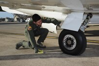 Maj. Kevin Kotula, 99th Flying Training Squadron, makes a final inspection prior to the launch of a T-1 Jayhawk aircraft on Joint Base San Antonio-Randolph March 6, 2012. The 99th FTS is an important part of the Pilot Instructor Training program at JBSA-Randolph. (U.S. Air Force photo by Rich McFadden) (released)