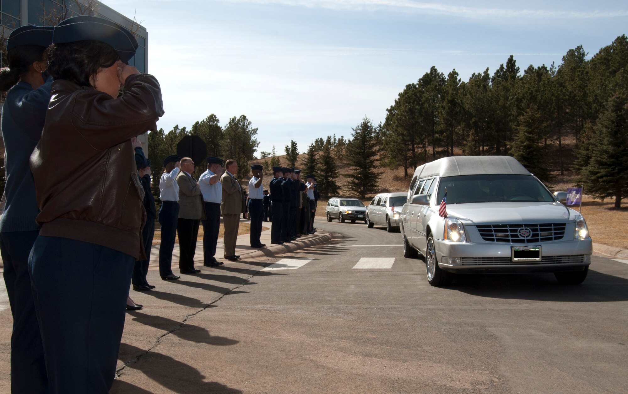 Airmen at the Air Force Academy render honors to Capt. Ryan Hall, who was interred at the Academy Cemetery in Colorado Springs, Colo., March 12, 2012. Hall, a native of Colorado Springs, was killed when his U-28A crashed Feb. 18. Hall was deployed to Djibouti in support of Operation Enduring Freedom. (U.S. Air Force photo/Don Branum)