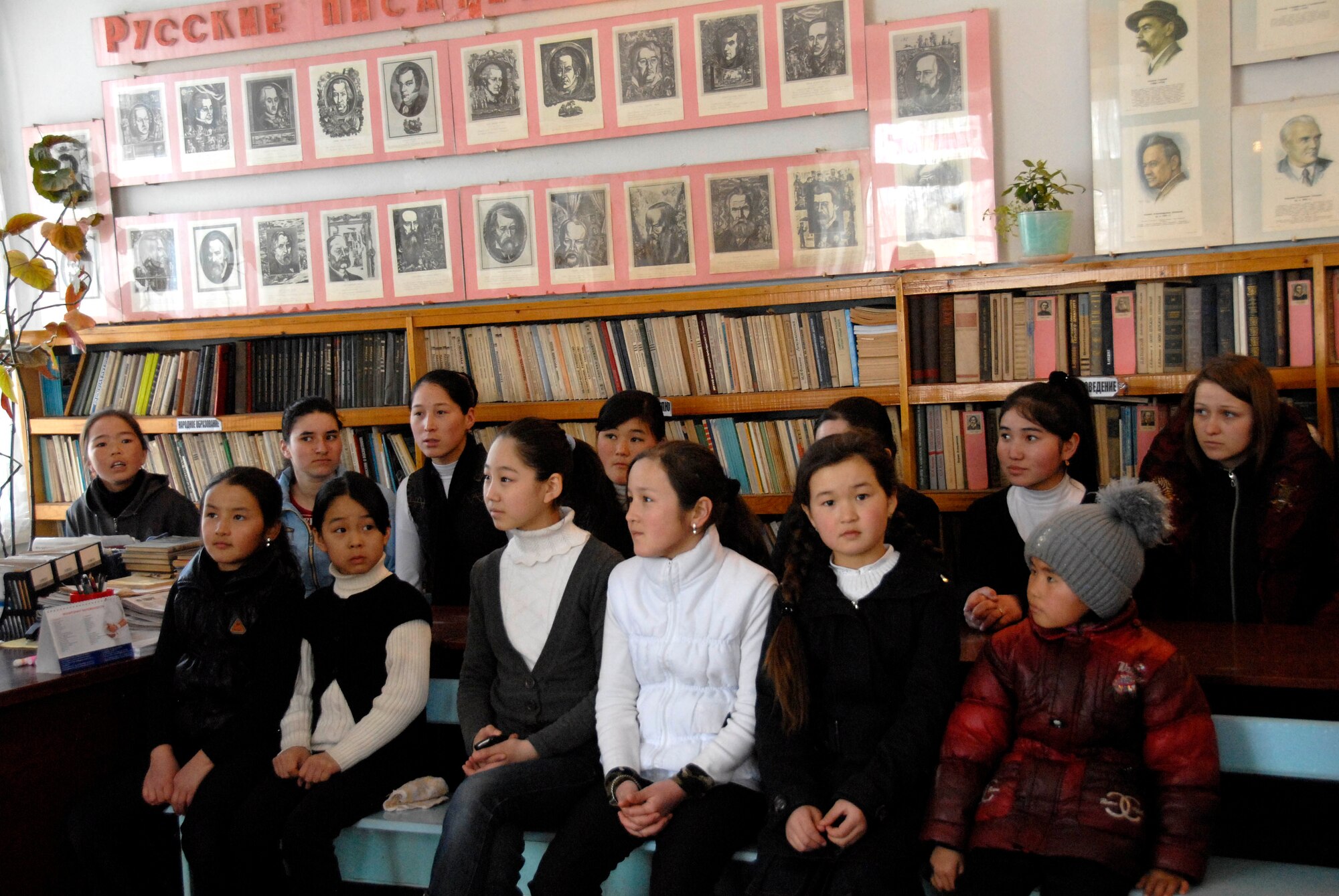 Students wait patiently to receive jackets at the Jany Pahkta School in Bishkek, Kyrgyzstan, March 15, 2012. Airmen from the 376th Expeditionary Force Support Squadron visited the school to donate school supplies deliver winter coats. (U.S. Air Force photo/Senior Airman Lynsie Nichols)
