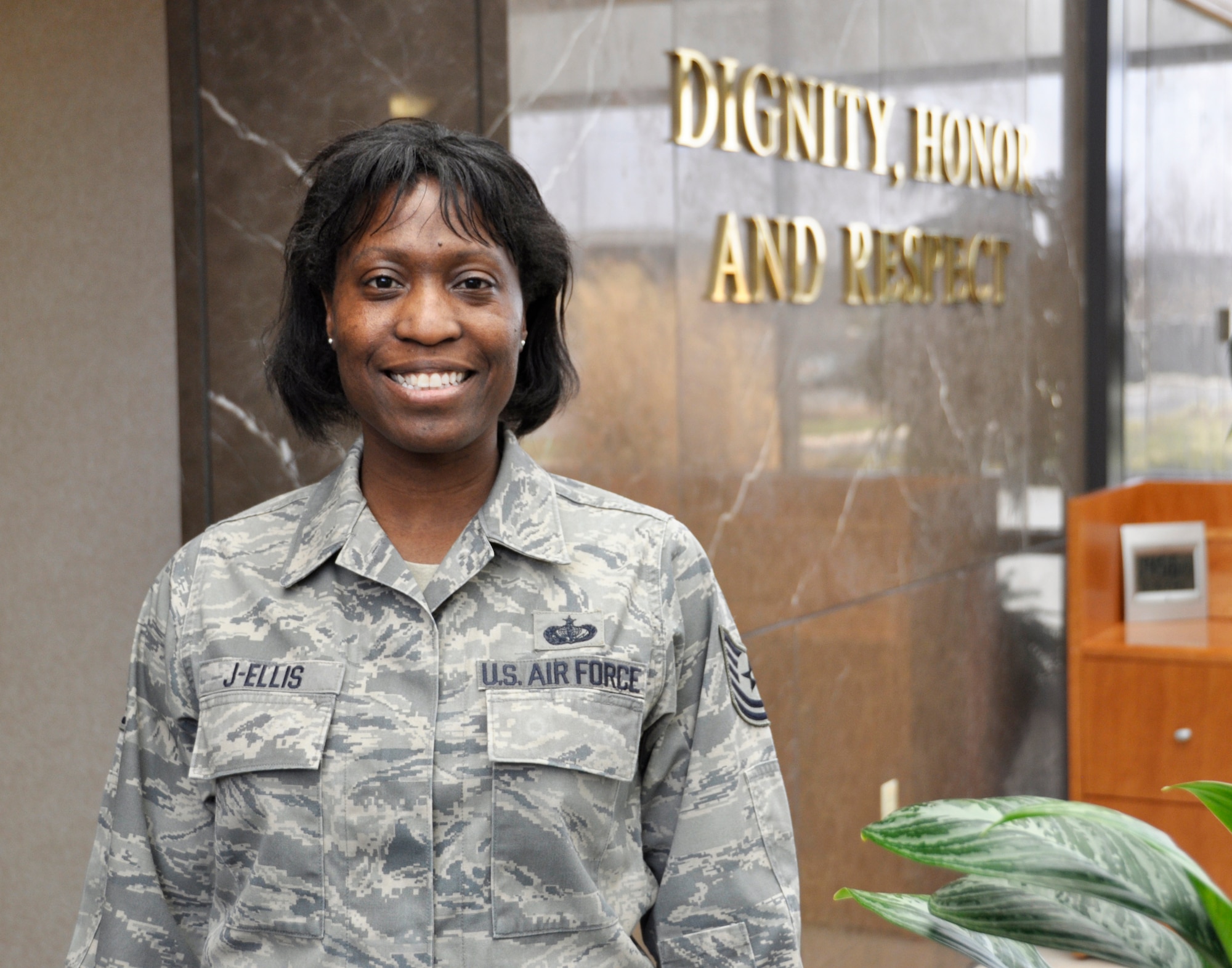 Tech. Sgt. Enid J-Ellis, a 512th Airlift Wing reservist who is currently deployed as a C3 technician to the Air Force Mortuary Affairs Operations, Dover Air Force Base, Del., dedicates her poem, "The Knight in American Armor" to the servicemen and women, defending the nation in times of war. J-Ellis has authored three books of poetry for self healing and courage for others. (U.S. Air Force photo by Tech. Sgt. Myco Apat)