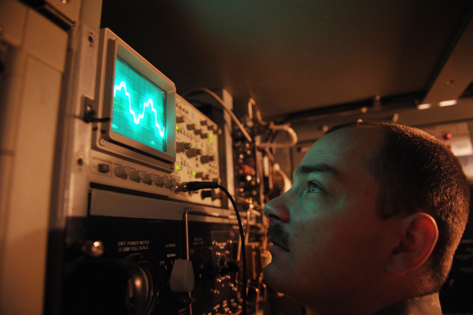 Senior Airman Joseph Fletcher, 71st Expeditionary Air Control Squadron radar maintenance technician and native of Tacoma, Wash., watches the frequency change on an oscilloscope while performing a function check on a TPS-75 radar here March 13, 2012. The TPS-75 is a mobile aerospace control and warning radar that has been in service since 1968. (U.S. Air Force photo/Staff Sgt. Nathanael Callon)