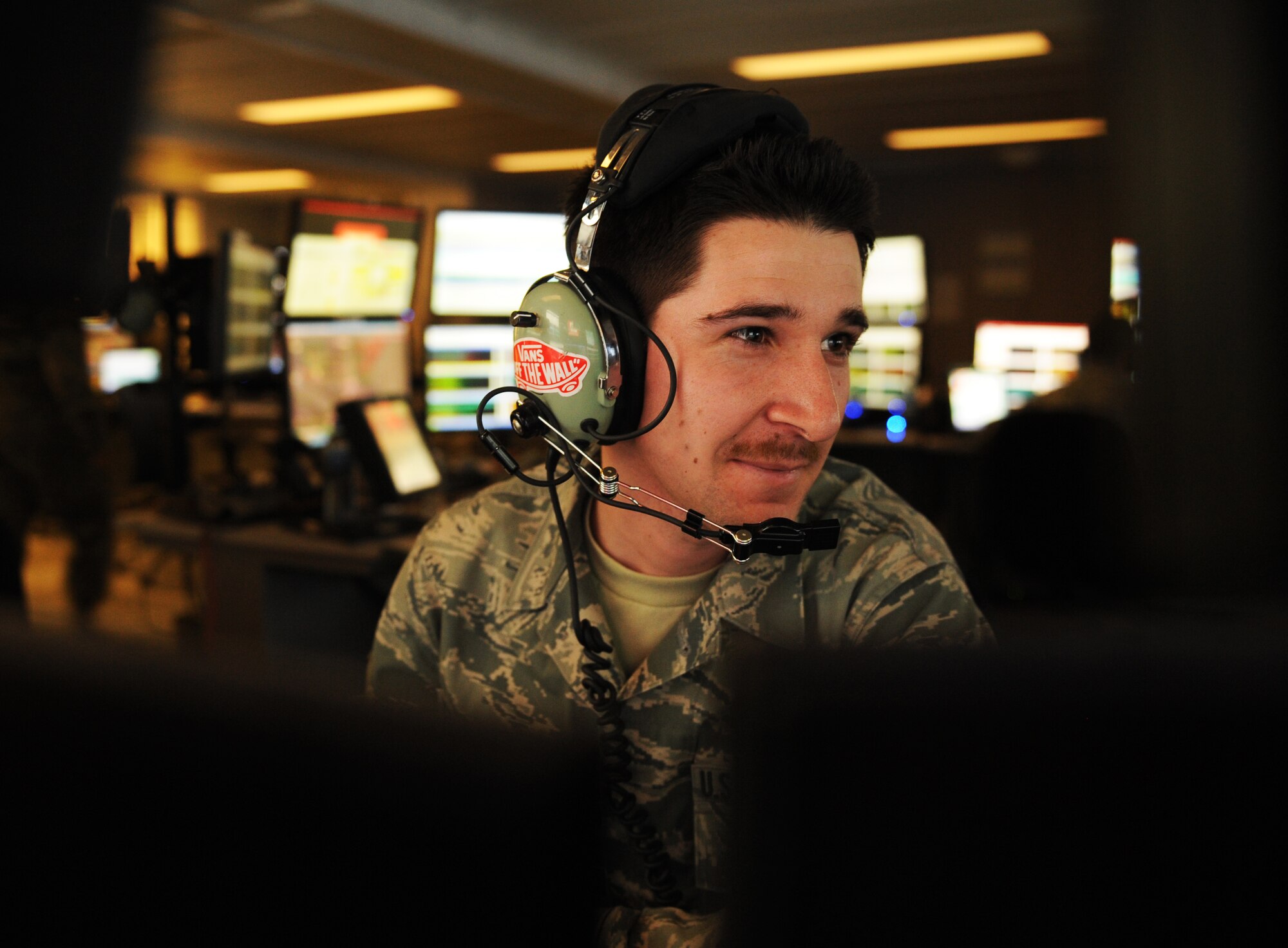Airman 1st Class Kevin Castleberry, 71st Expeditionary Air Control Squadron surveillance technician and native of San Diego, observes activity on his radar here March 10, 2012. Castleberry observes up to eight computer monitors at one time to control his designated area of responsibility over the skies of Afghanistan. (U.S. Air Force photo/Staff Sgt. Nathanael Callon)