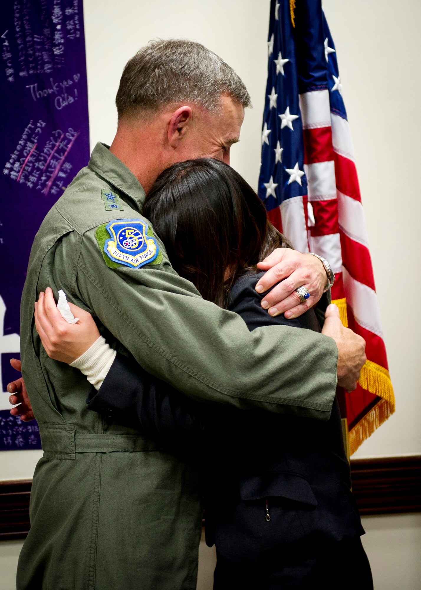 YOKOTA AIR BASE, Japan -- Lt. Gen. Burton Field, United States Forces Japan commander and 5th Air Force commander, gives Tomo Ishikawa, Gakushuin Women's College student, a hug after she presented him 1,000 origami cranes March 16, 2012. The students made a total of 4,000 origami cranes and gave 1,000 to a member of each service. (U.S. Air Force photo/Staff Sgt. Chad C. Strohmeyer)