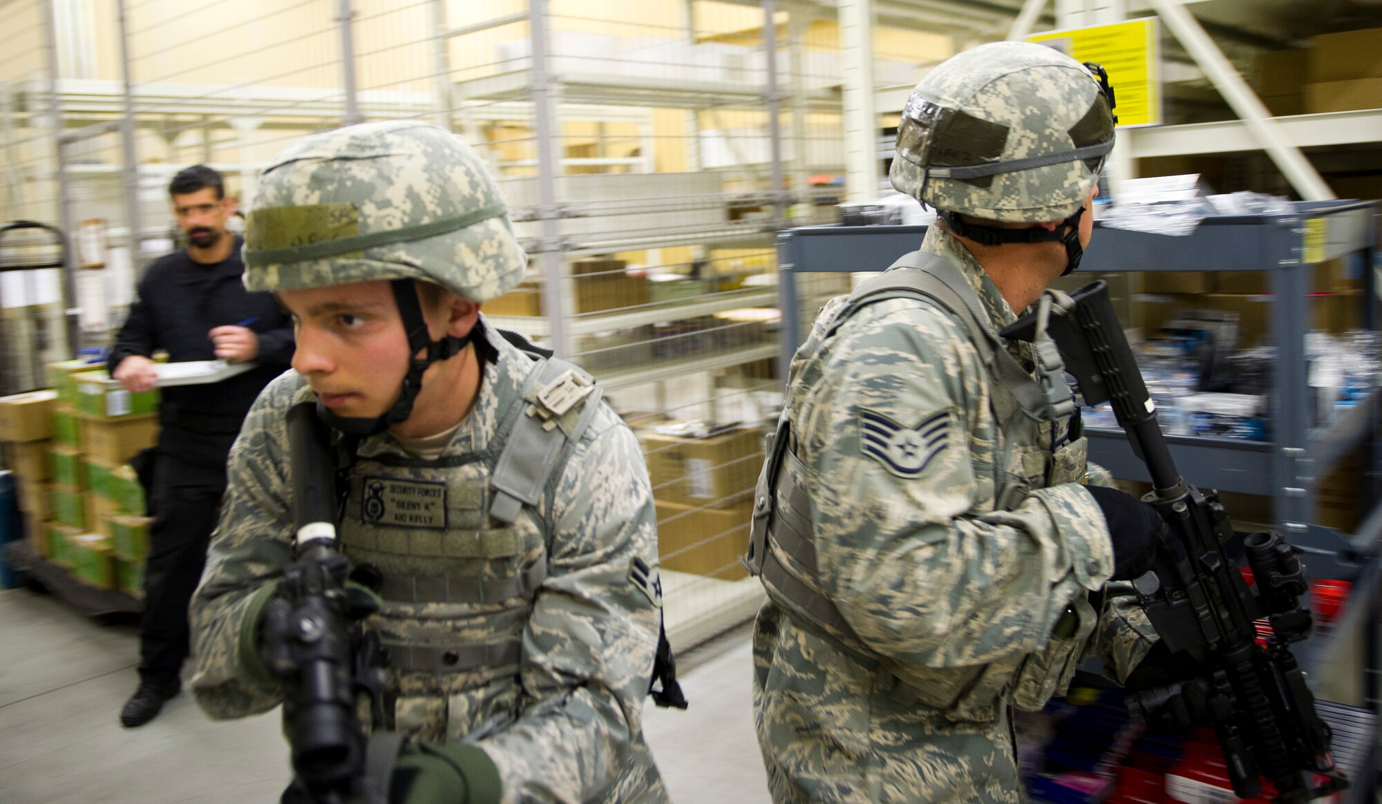 YOKOTA AIR BASE, Japan -- Airman 1st Class Patrick Kelly, 374th Security Forces Squadron patrolman, searches for a shooter during an active shooter scenario in the base exchange March 15, 2012. Security forces personnel recieve this training annually and is designed to give them the tactics, techniques and procedures to find and neutralize a threat. (U.S. Air Force photo/Staff Sgt. Chad C. Strohmeyer)