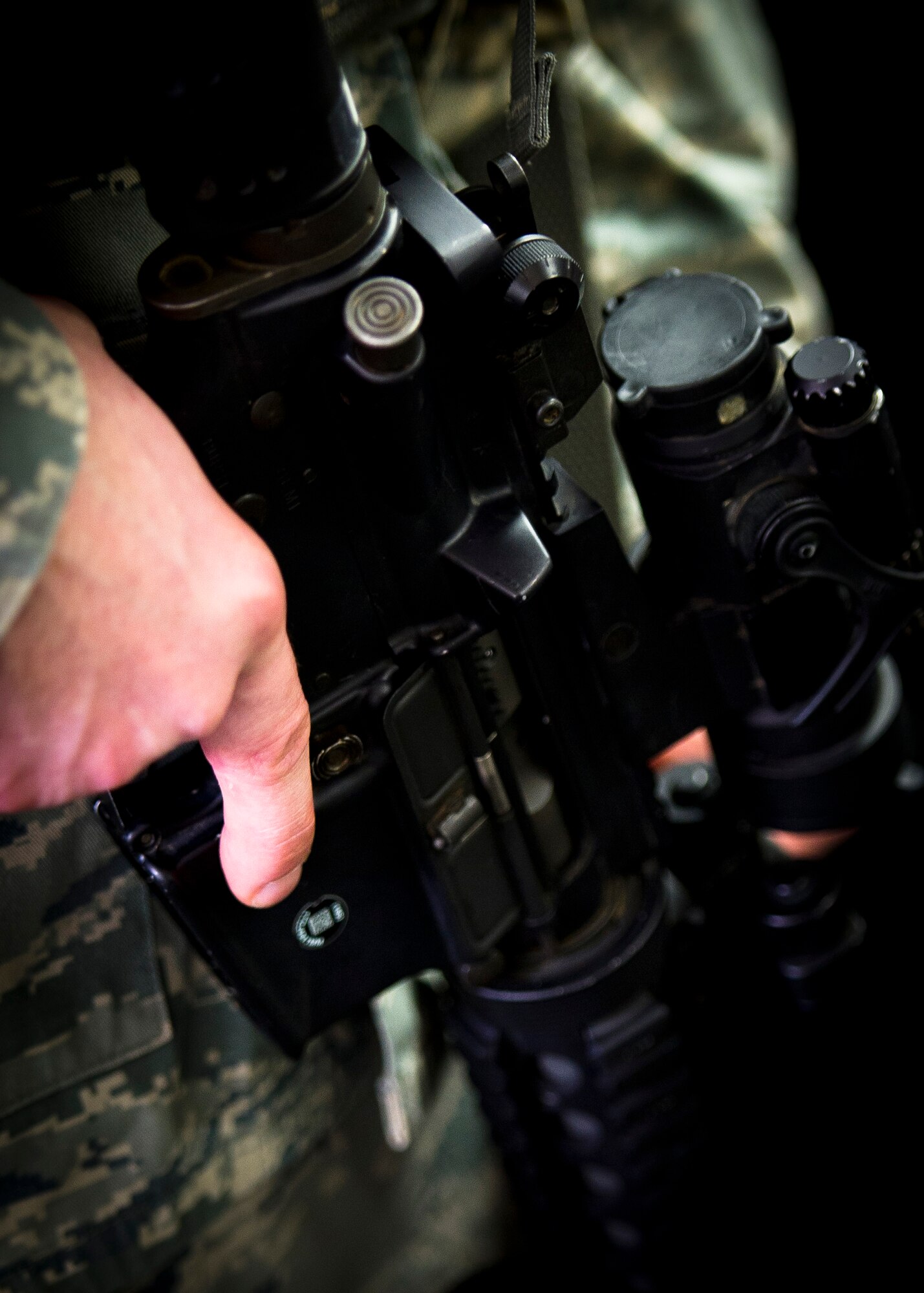 YOKOTA AIR BASE, Japan -- A 374th Security Forces Squadron patrolman, hold his M-4 Rifle during an active shooter scenario March 15, 2012. Security forces personnel recieve this training annually and is designed to give them the tactics, techniques and procedures to find and neutralize a threat. (U.S. Air Force photo/Staff Sgt. Chad C. Strohmeyer)