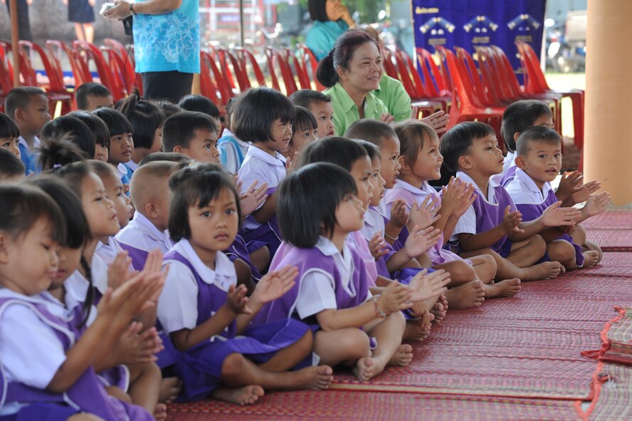 Students from the Watprommarat School, Nakhon Ratchasima Province, Thailand, enjoy a Royal Thai Air Force Band performance during a Cope Tiger community outreach and cultural exchange event here, Mar. 13. The school was visited by more than 40-Airmen from the U.S. Air Force, Republic of Singapore Air Force, and exercise host, Royal Thai Air Force. The Airmen are participating in exercise Cope Tiger, a large force air employment exercise designed to enhance readiness and interoperability among participating nations in the Asia-Pacific region. (U.S. Air Force Photo/Capt. David Herndon)