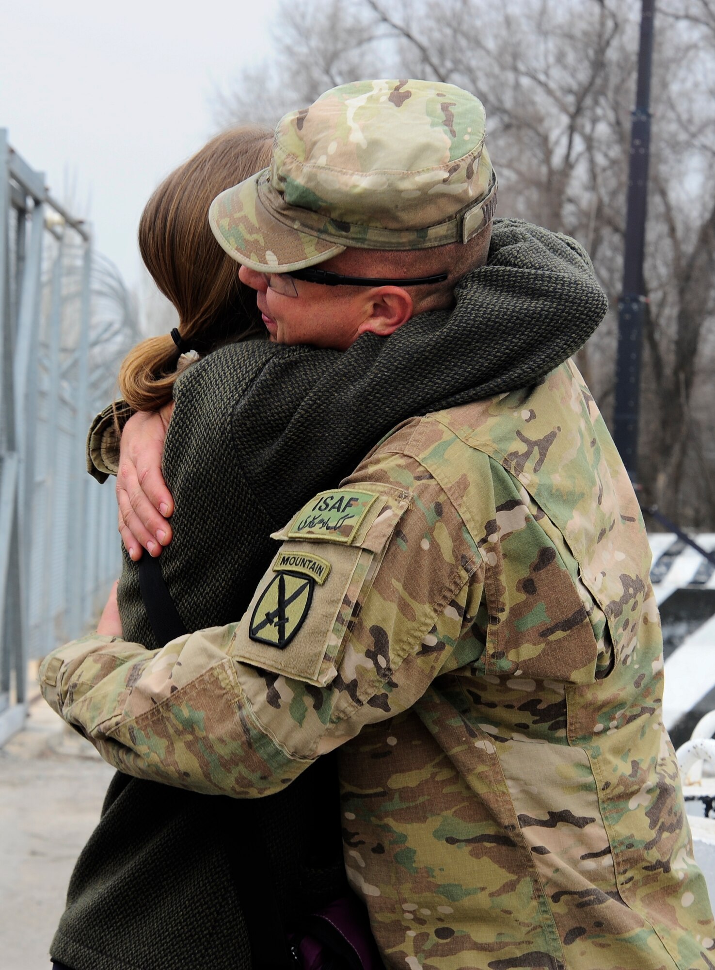 Eleanor Smith hugs her brother, Army Maj. John Womack, March 16, 2012, during a reunion between the siblings at the Transit Center at Manas, Kyrgyzstan. Womack is an Afghan Security Forces advisor originally from Nashville, deployed from Fort Drum, N.Y. (U.S. Air Force photo/Staff Sgt. Angela Ruiz)