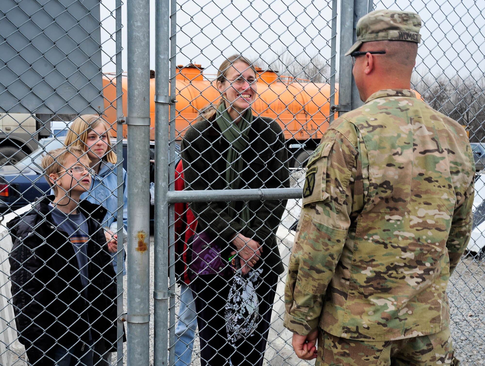 Eleanor Smith smiles excitedly while talking to her brother, Army Maj. John Womack, for the first time in a year March 16, 2012, while awaiting access to the Transit Center at Manas, Kyrgyzstan. Womack is returning home after a 12-month deployment in Afghanistan and is passing through the Transit Center. Smith lives in Kyrgyzstan with her husband and three children. (U.S. Air Force photo/Staff Sgt. Angela Ruiz)
