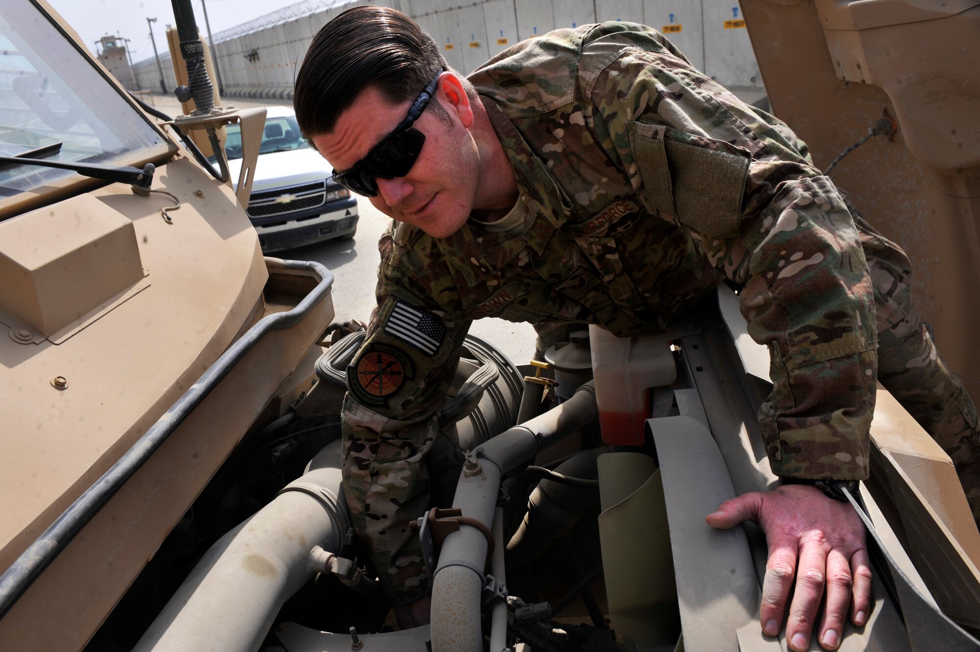 BAGRAM AIRFIELD, Afghanistan—Staff Sgt. Andrew Brown pauses while working on an engine at Bagram Airfield, Afghanistan, March 17, 2012. Brown is the noncommissioned officer in charge of vehicle operations with the 817th Expeditionary Air Support Operations Squadron and is deployed from Fort Hood, TX. (U.S. Air Force photo/Airman 1st Class Ericka Engblom)