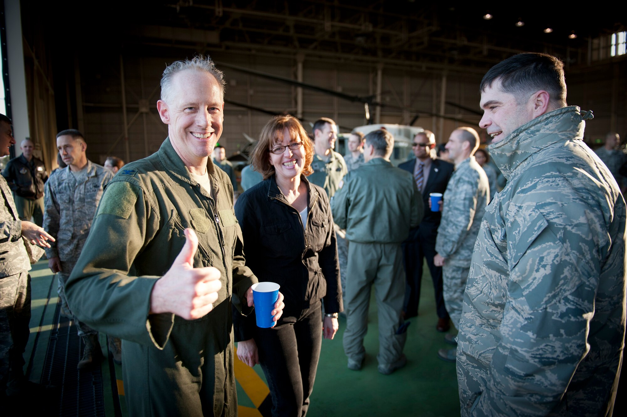 YOKOTA AIR BASE, Japan -- Col. Otto Feather (left), 374th Airlift Wing commander, gives a "thumbs up" to the camera at Yokota Air Base, Japan, March 15, 2012. Feather made his final flights in each of the wing's three airframes during that day. (U.S. Air Force photo/Staff Sgt. Samuel Morse)