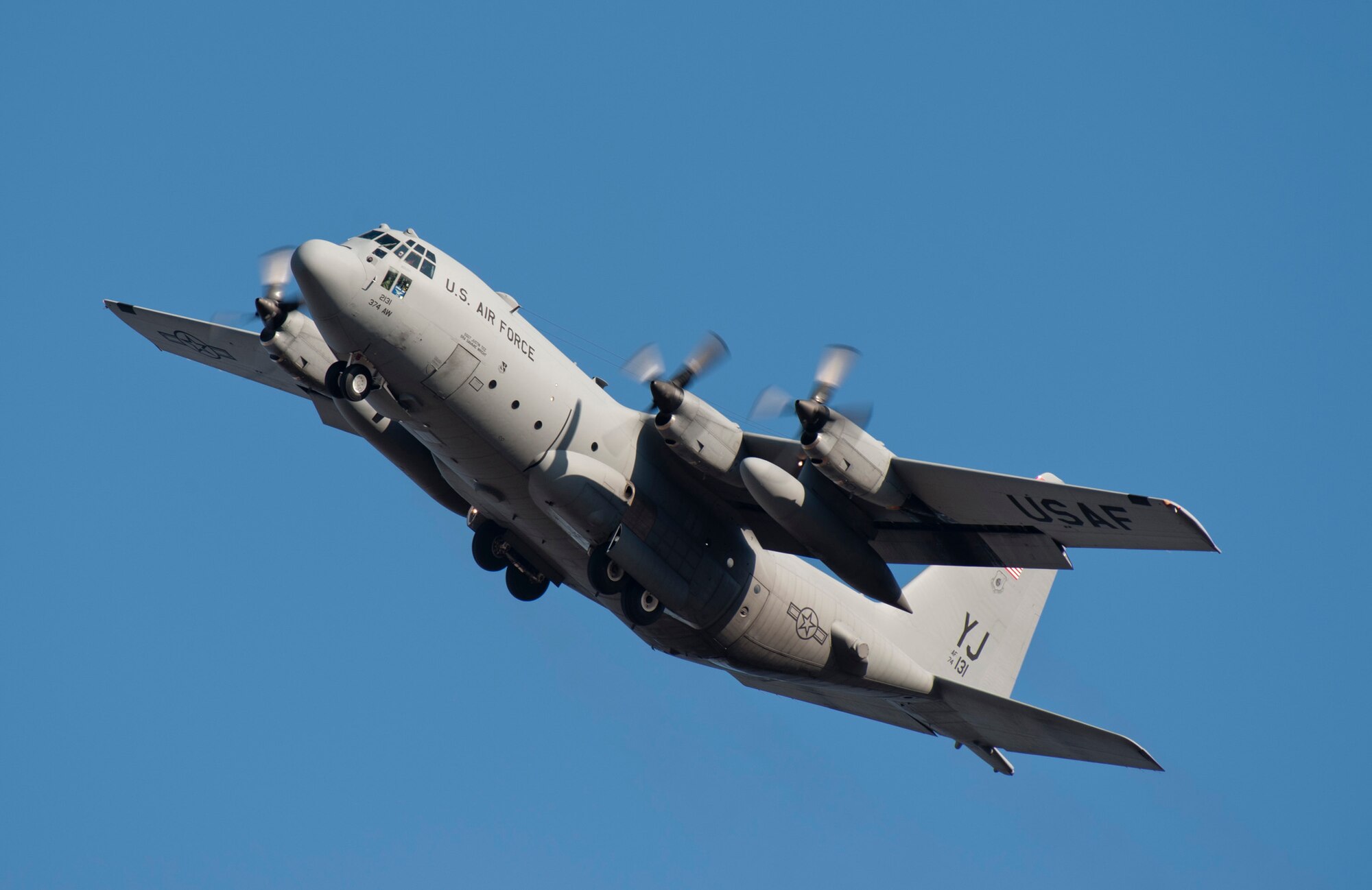 YOKOTA AIR BASE, Japan -- Col. Otto Feather, 374th Airlift Wing commander, flies over Yokota Air Base, Japan, in a C-130 Hercules March 15, 2012. Feather made his final flights in each of the wing's three airframes during that day. (U.S. Air Force photo/Staff Sgt. Samuel Morse)