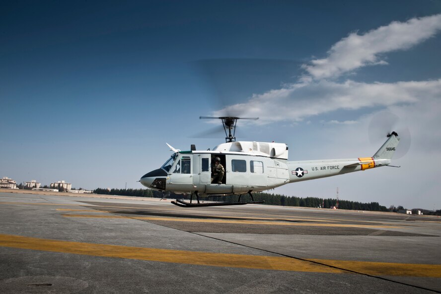 YOKOTA AIR BASE, Japan -- Col. Otto Feather, 374th Airlift Wing commander, takes off in a UH-1N Iroquois at Yokota Air Base, Japan, March 15, 2012. Feather made his final flights in each of the wing's three airframes during that day. (U.S. Air Force photo/Staff Sgt. Samuel Morse)