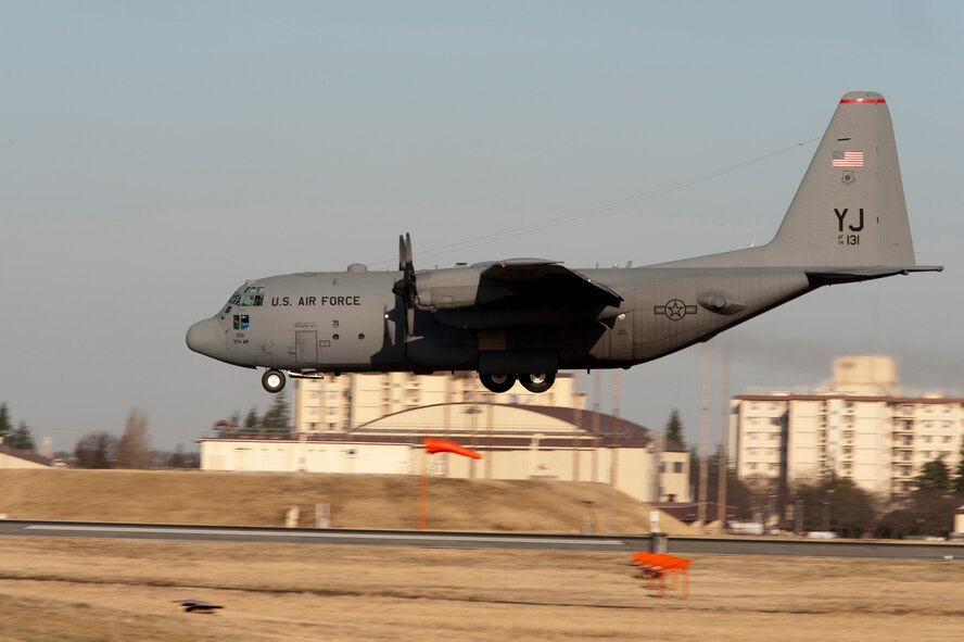 YOKOTA AIR BASE, Japan -- A C-130 Hercules lands at Yokota Air Base, Japan, March 15, 2012. A C-130 can carry up to six pallets or 74 litters or 16 CDS bundles or 92 combat troops or 64 paratroopers, or a combination of any of these up to the cargo compartment capacity or maximum allowable weight. (U.S. Air Force photo/Staff Sgt. Samuel Morse)