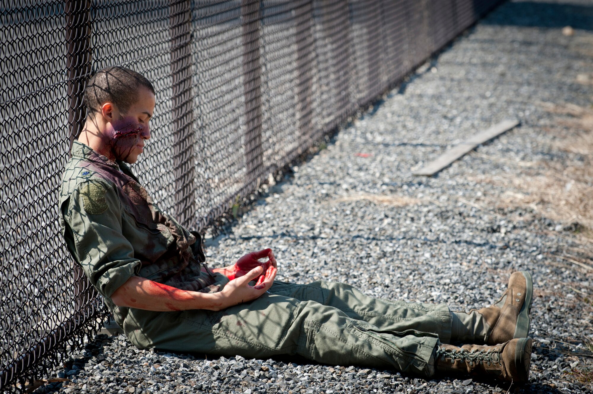 YOKOTA AIR BASE, Japan -- An exercise role player gets into character during an emergency management exercise at Yokota Air Base, Japan, March 14, 2012. The 374th Airlift Wing held the EME to test and train its Airmen to respond to emergencies quickly and effectively. (U.S. Air Force photo/Staff Sgt. Samuel Morse)