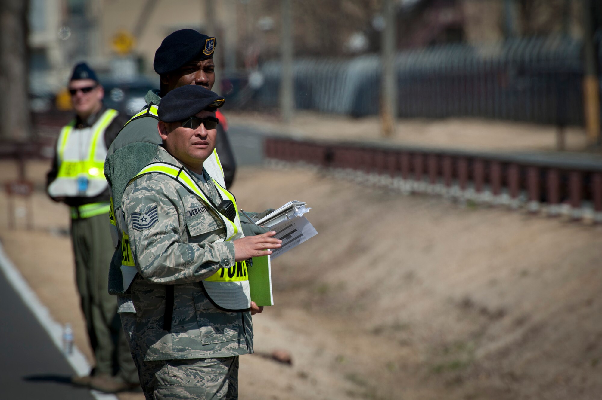 YOKOTA AIR BASE, Japan -- Exercise evaluation team members watch first responders arrive during an emergency management exercise at Yokota Air Base, Japan, March 14, 2012. The 374th Airlift Wing held the EME to test and train its Airmen to respond to emergencies quickly and effectively. (U.S. Air Force photo/Staff Sgt. Samuel Morse)